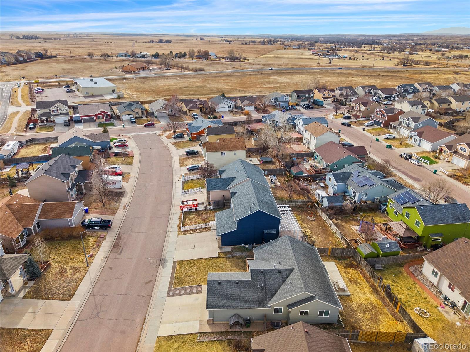 11360 Berry Farm Road Fountain, CO 80817 - Photo 44 of 44 an aerial view of residential building and lake view