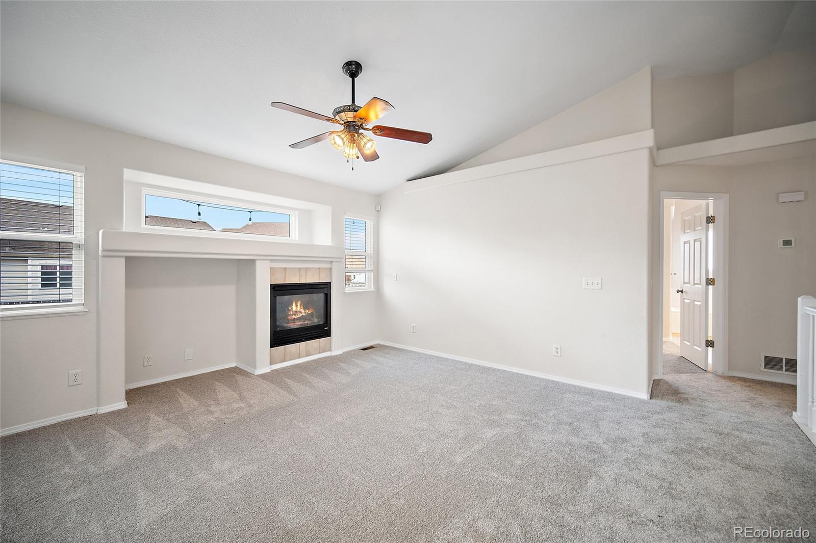11360 Berry Farm Road Fountain, CO 80817 - Photo 9 of 44 a view of an empty room with window and fireplace