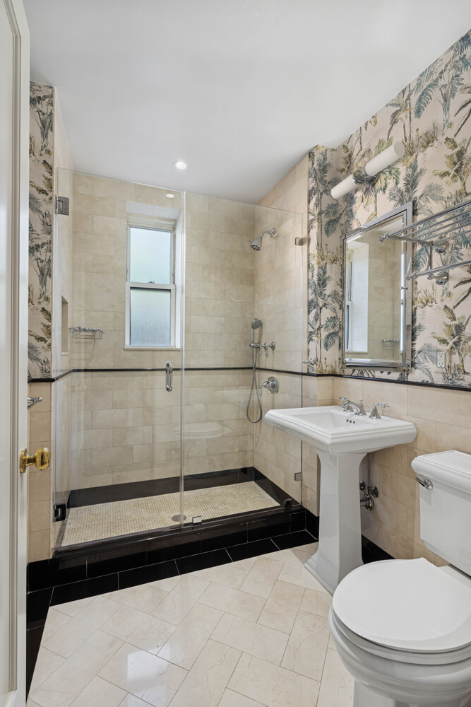 25 5th Avenue, Unit 3G Manhattan, NY 10003 - Photo 6 of 9 a bathroom with a sink a toilet and shower