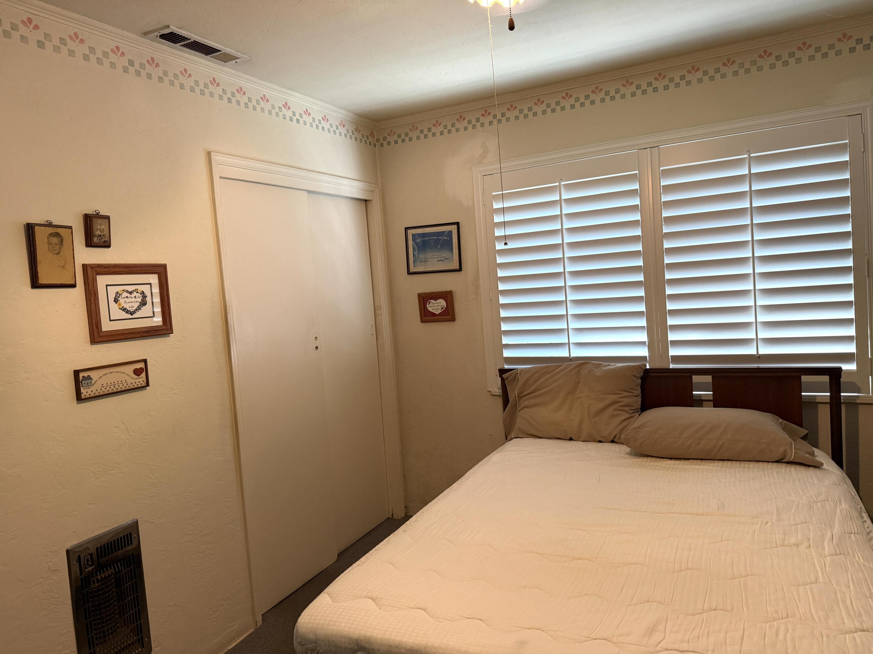 918 Parsons Drive Redding, CA 96002 - Photo 13 of 31 a bedroom with a bed and a window