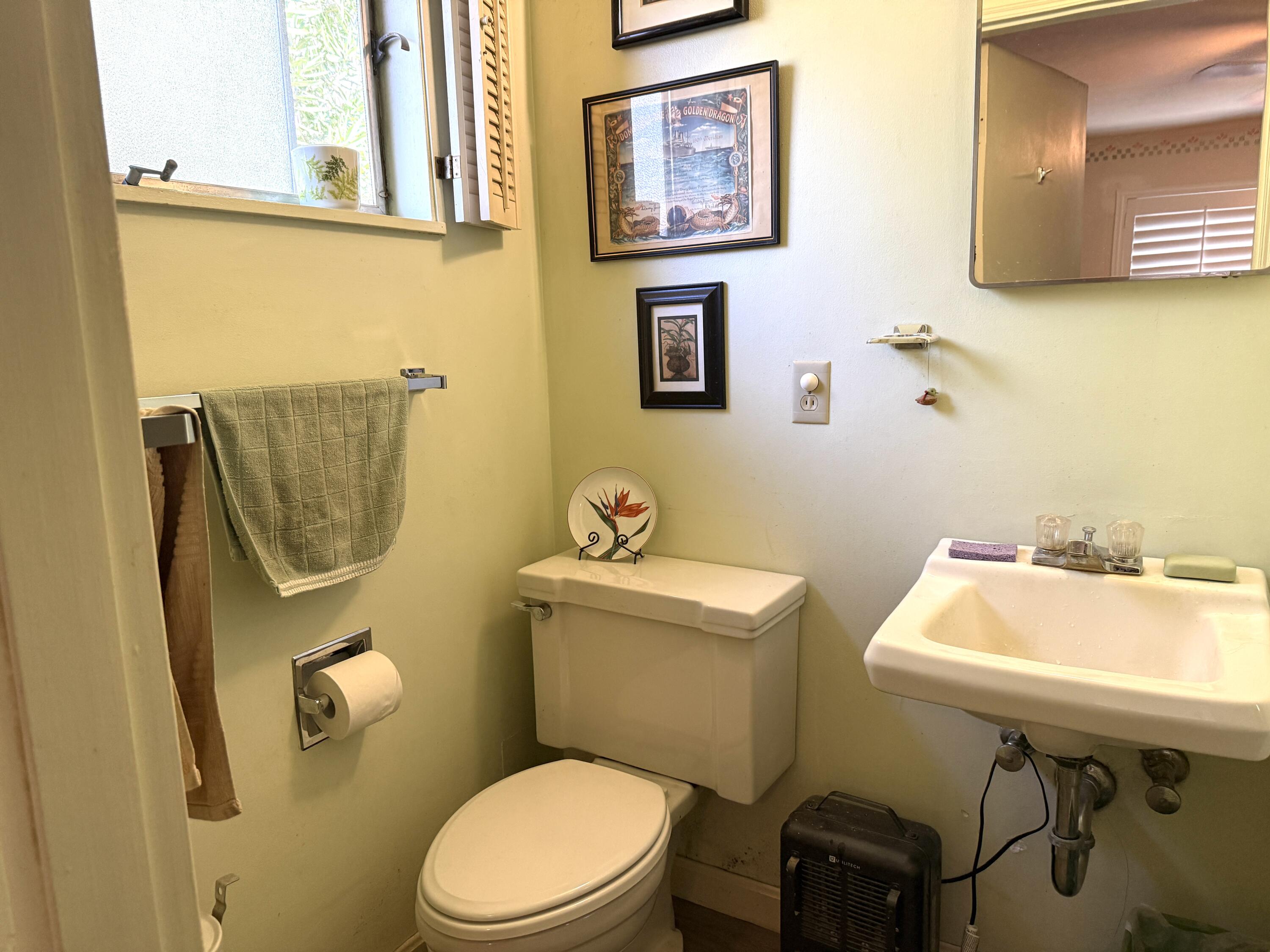 918 Parsons Drive Redding, CA 96002 - Photo 14 of 31 a bathroom with a toilet a sink and mirror