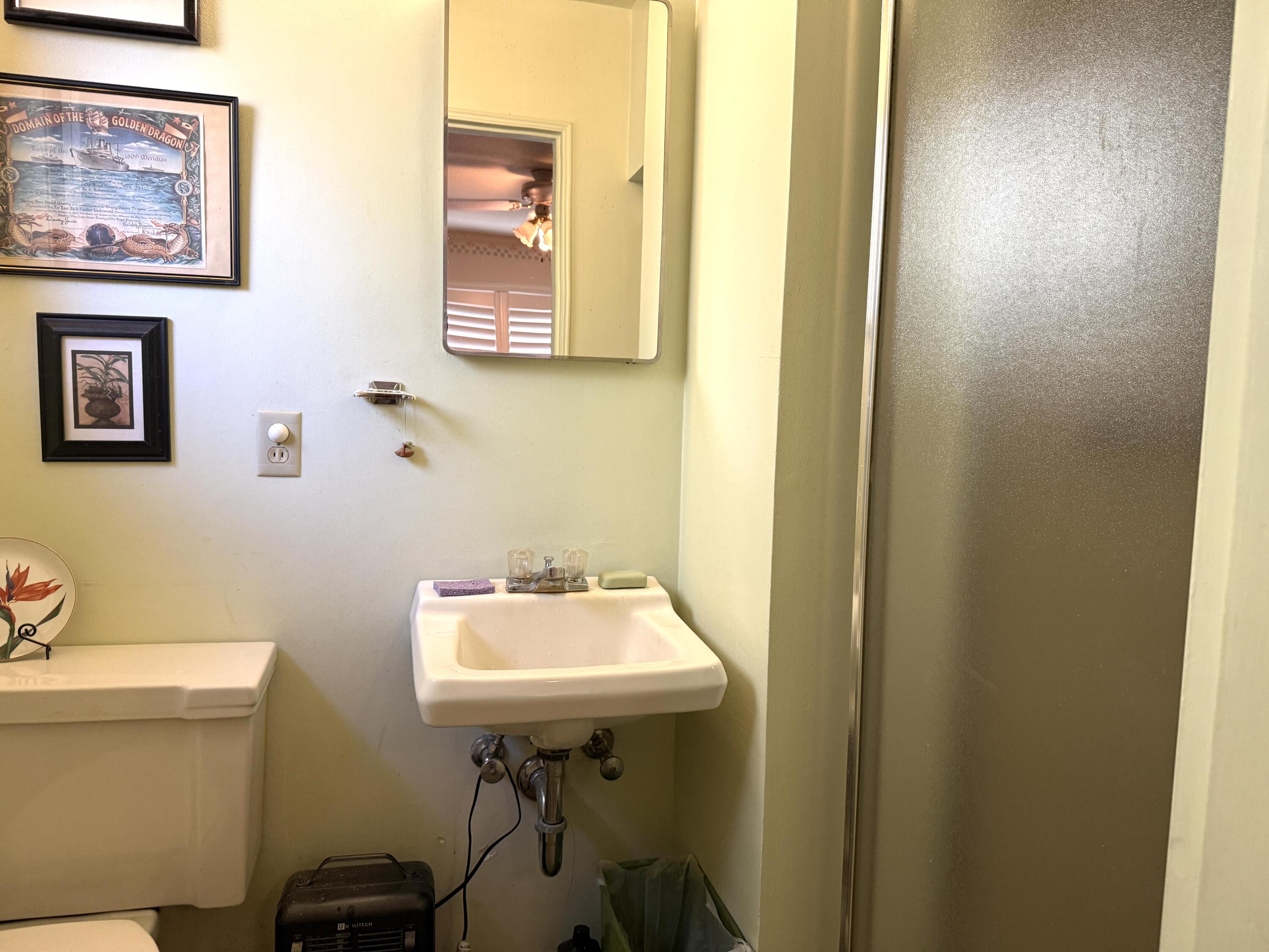 918 Parsons Drive Redding, CA 96002 - Photo 15 of 31 a bathroom with a sink a mirror and a toilet