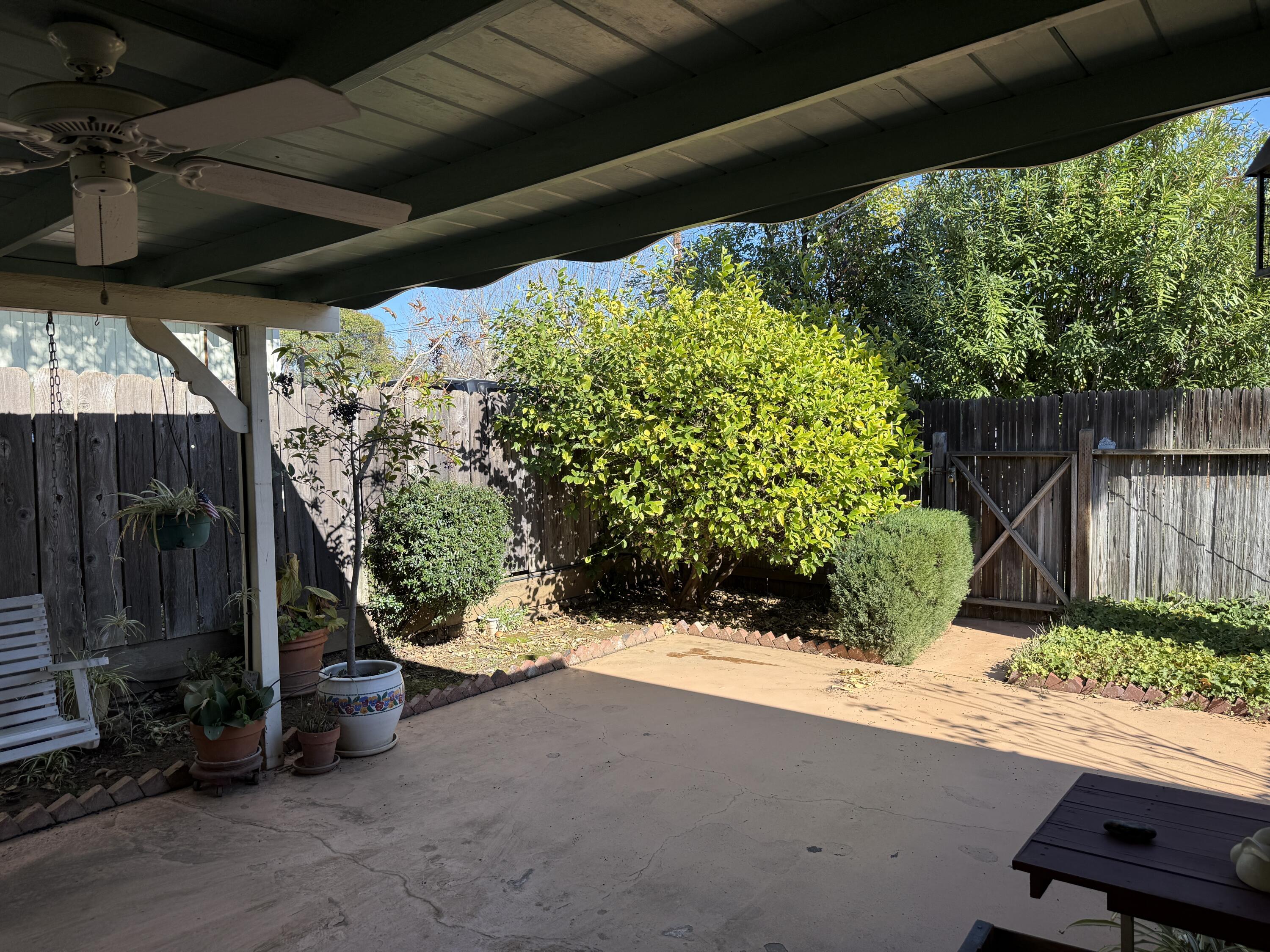 918 Parsons Drive Redding, CA 96002 - Photo 25 of 31 a view of a porch with furniture and a yard