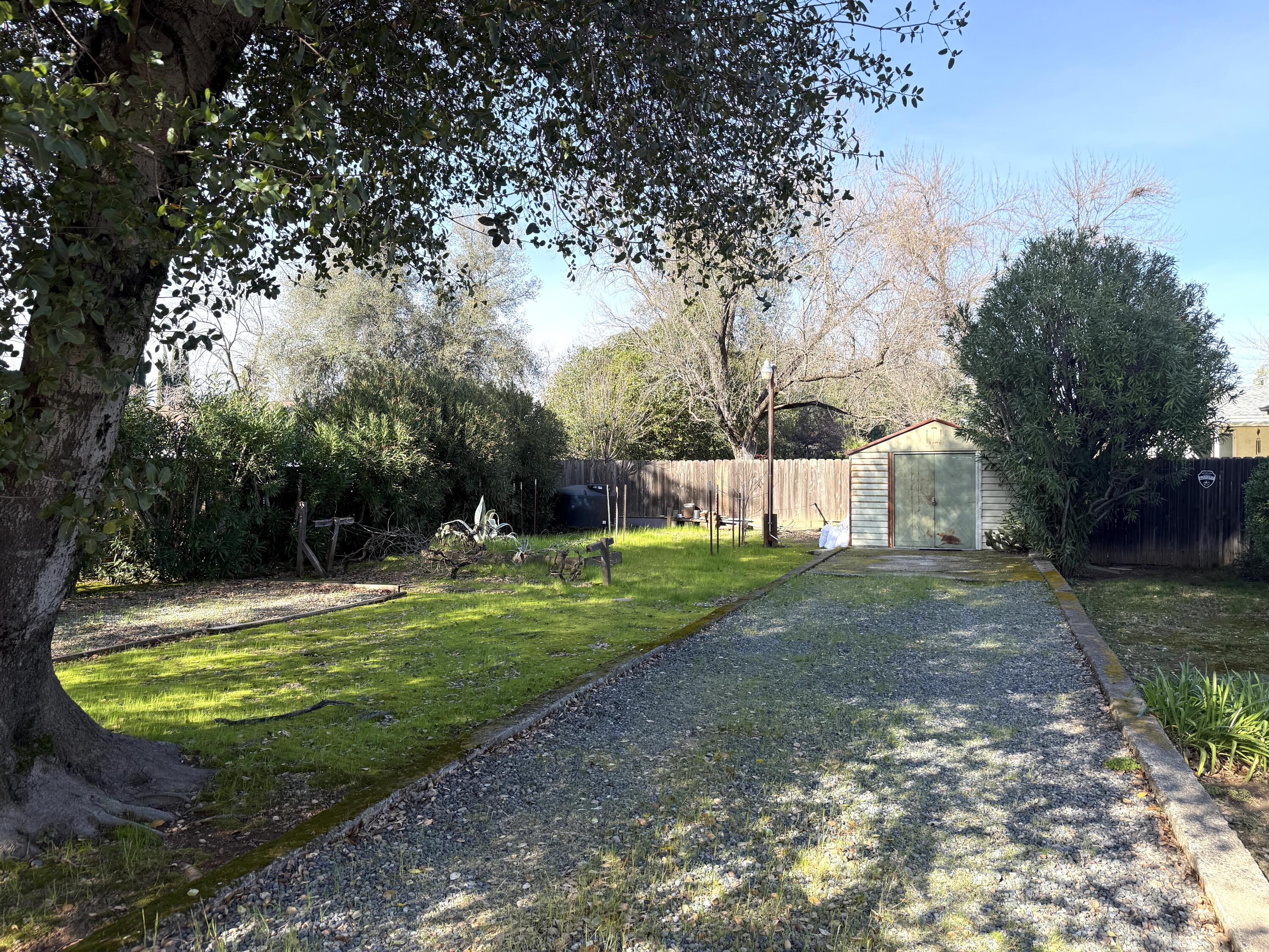 918 Parsons Drive Redding, CA 96002 - Photo 28 of 31 a view of a fountain in a yard with palm trees