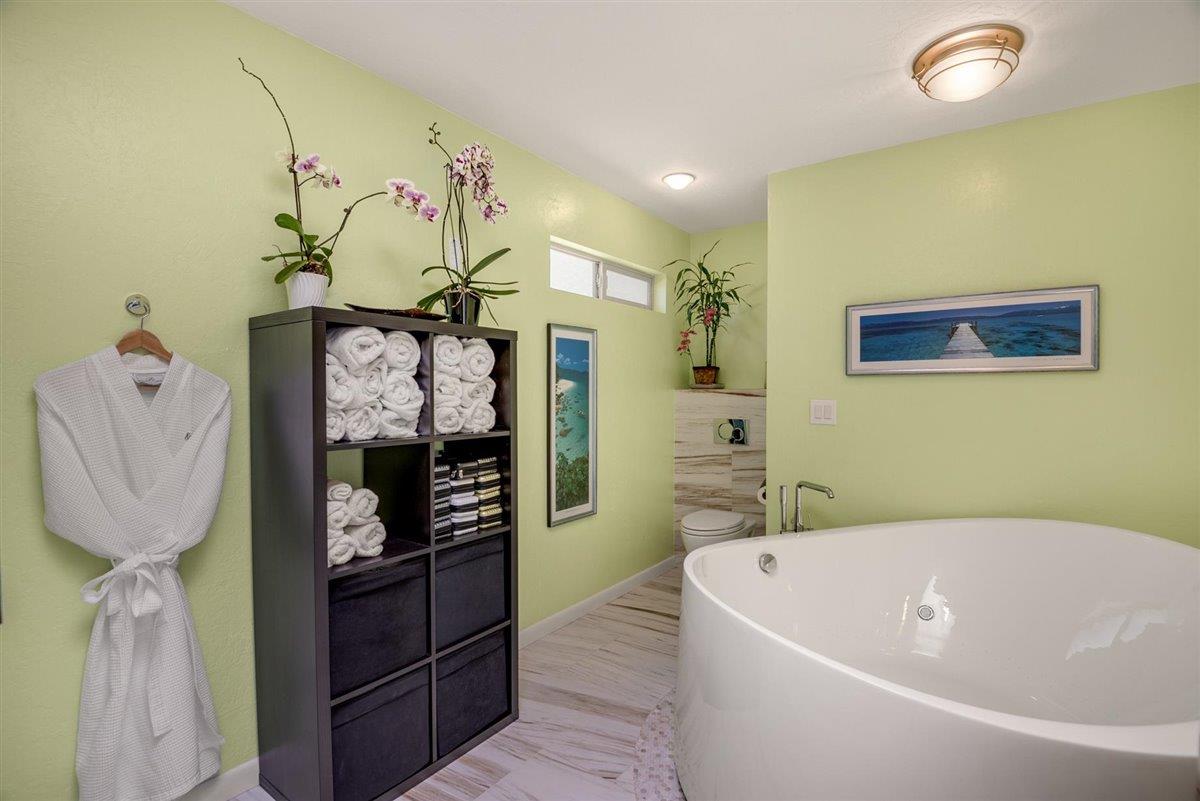 16300 Old Ranch Road Los Gatos, CA 95033 - Photo 11 of 26 a bathroom with a bathtub sink and mirror