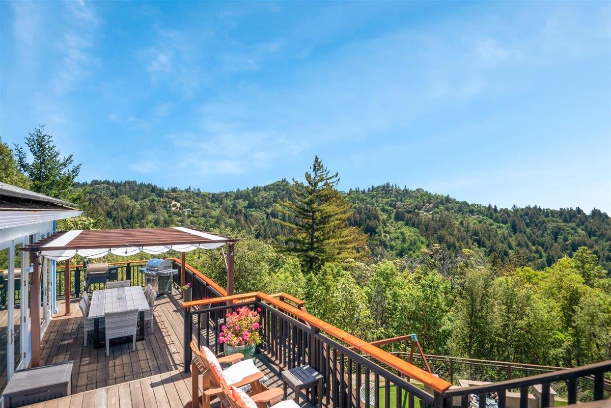 16300 Old Ranch Road Los Gatos, CA 95033 - Photo 12 of 26 a view of a balcony with chairs and wooden fence