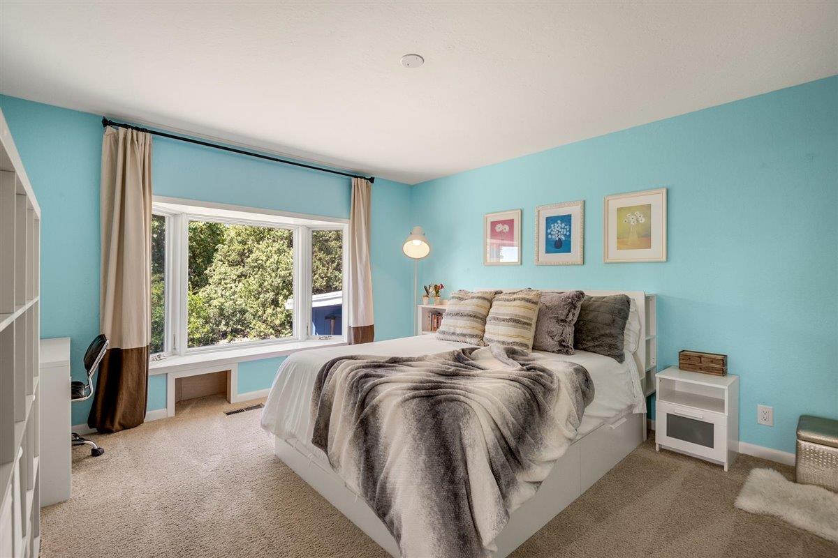16300 Old Ranch Road Los Gatos, CA 95033 - Photo 13 of 26 a bed room with a bed and a large window