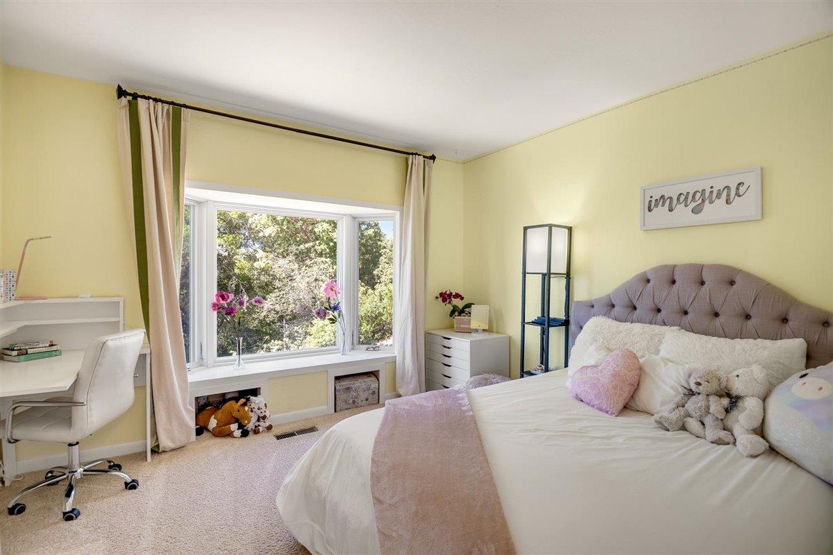 16300 Old Ranch Road Los Gatos, CA 95033 - Photo 14 of 26 a bedroom with a bed and large windows