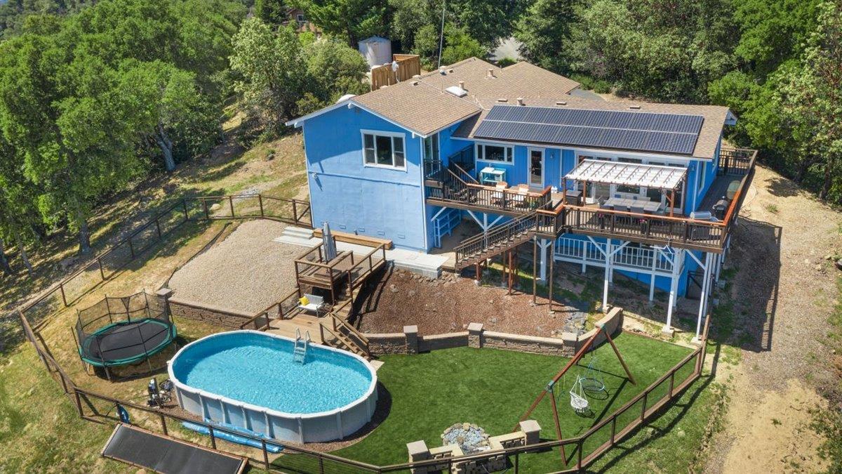 16300 Old Ranch Road Los Gatos, CA 95033 - Photo 18 of 26 an aerial view of a house with swimming pool garden and patio