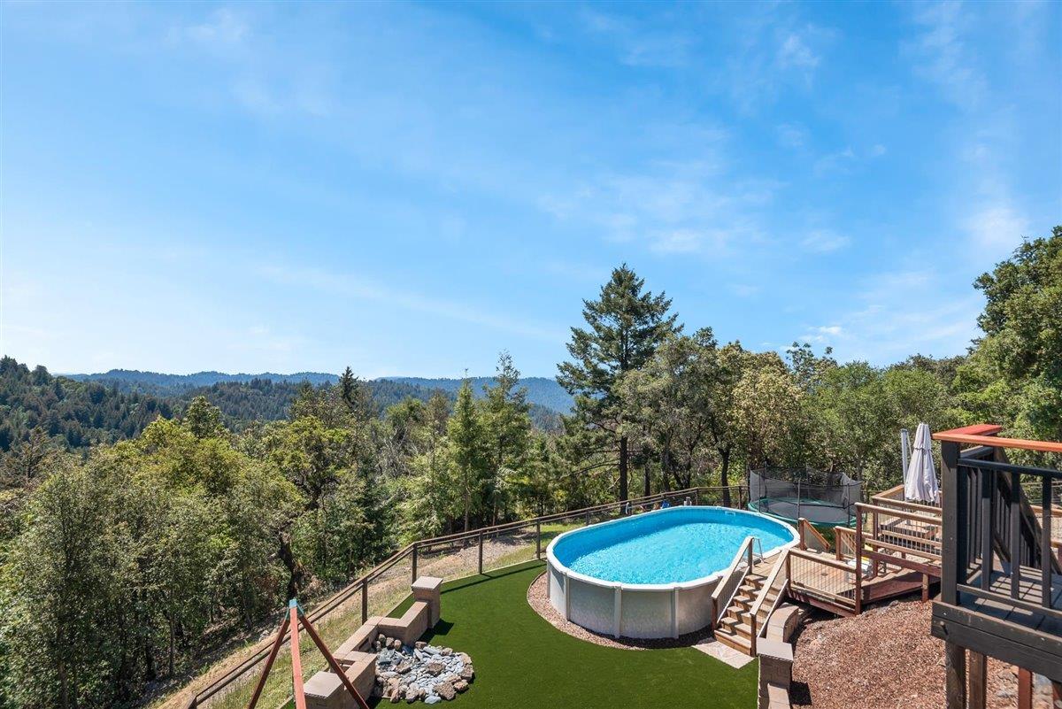 16300 Old Ranch Road Los Gatos, CA 95033 - Photo 20 of 26 a patio with a yard table and chairs