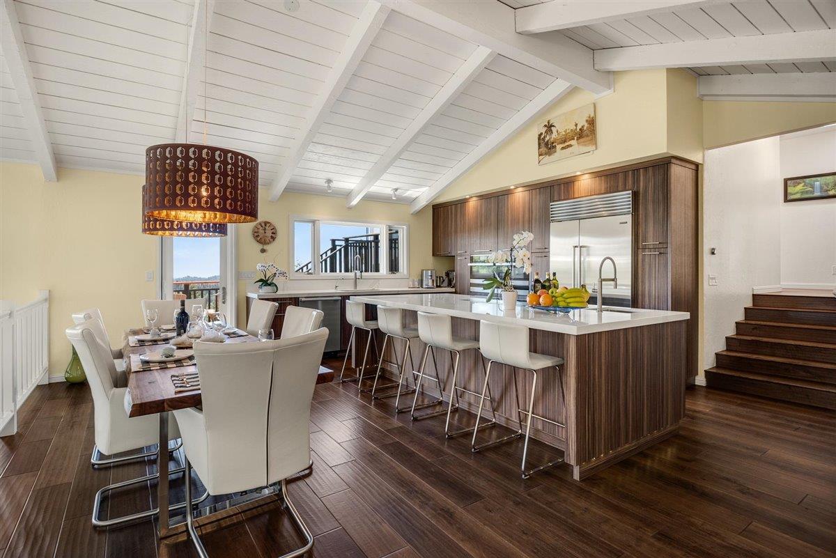 16300 Old Ranch Road Los Gatos, CA 95033 - Photo 2 of 26 a dining room with furniture a rug and wooden floor