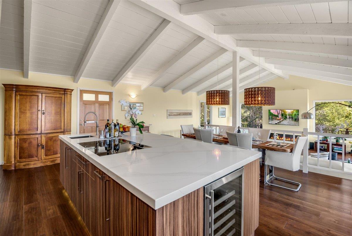 16300 Old Ranch Road Los Gatos, CA 95033 - Photo 3 of 26 a kitchen with stainless steel appliances granite countertop a sink a stove and a wooden floors