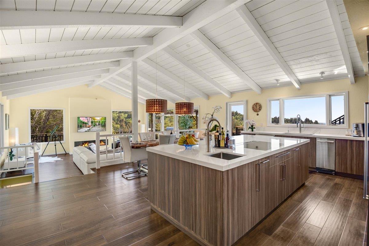 16300 Old Ranch Road Los Gatos, CA 95033 - Photo 4 of 26 a kitchen with counter top space a sink wooden floor and view living room