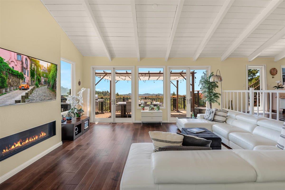 16300 Old Ranch Road Los Gatos, CA 95033 - Photo 6 of 26 a living room with furniture and a floor to ceiling window