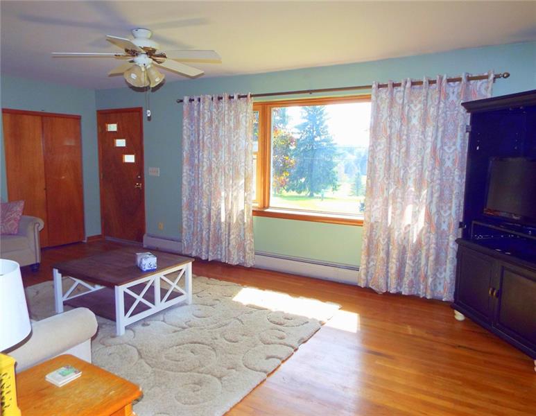 447 Harvey Road Foxburg, PA 16036 - Photo 6 of 23 Spacious living room with hardwood floors overlooks hole #6 of the golf course.