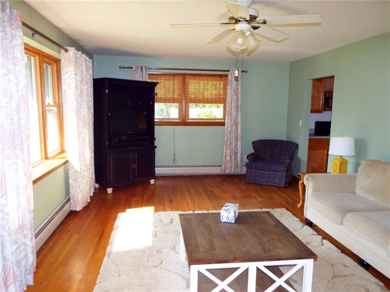 447 Harvey Road Foxburg, PA 16036 - Photo 7 of 23 Spacious living room with hardwood flooring and plenty of windows for great views and natural light.