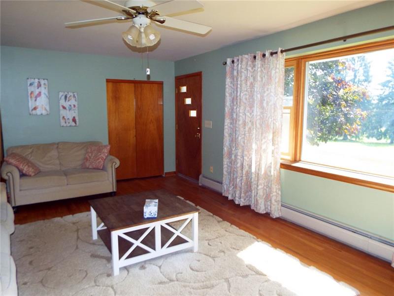 447 Harvey Road Foxburg, PA 16036 - Photo 8 of 23 Spacious living room with hardwood flooring and plenty of windows for great views and natural light.