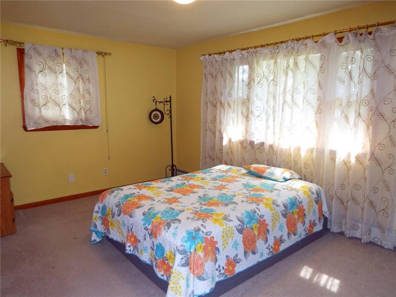 447 Harvey Road Foxburg, PA 16036 - Photo 9 of 23 Bedroom with multiple windows for natural light.