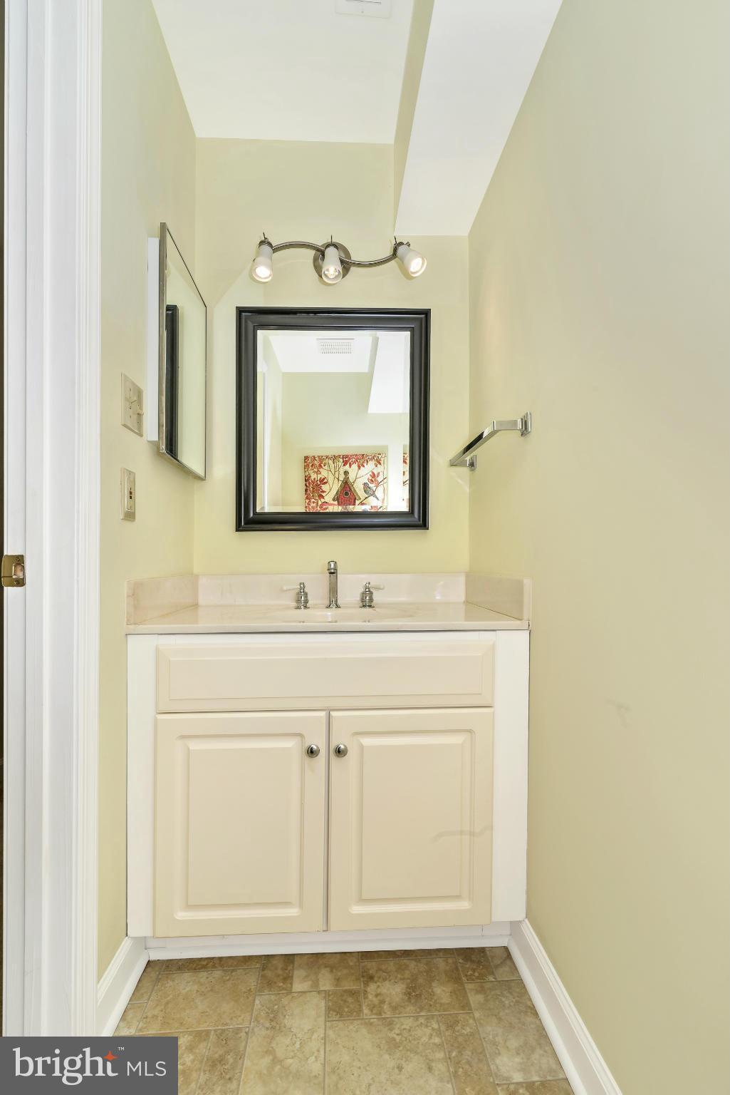 2443 Bear Den Road Frederick, MD 21701 - Photo 27 of 30 a bathroom with a sink and a mirror
