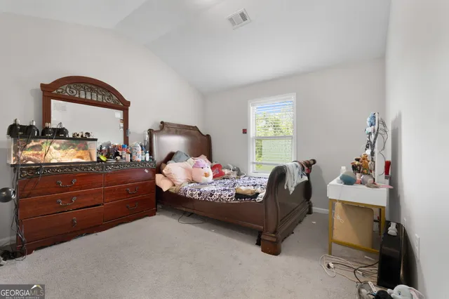 a bed room with furniture and a window