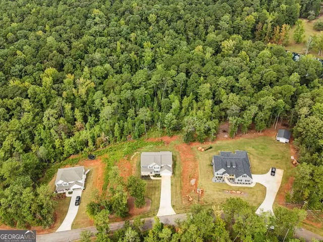 an aerial view of residential house with outdoor space
