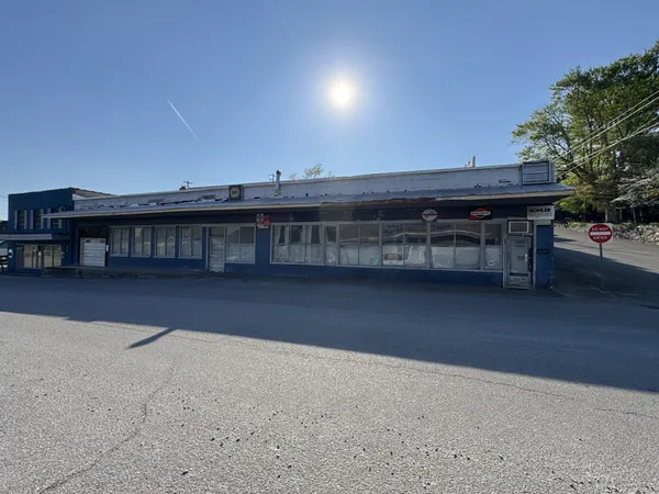 a view of a balcony with a table and chairs