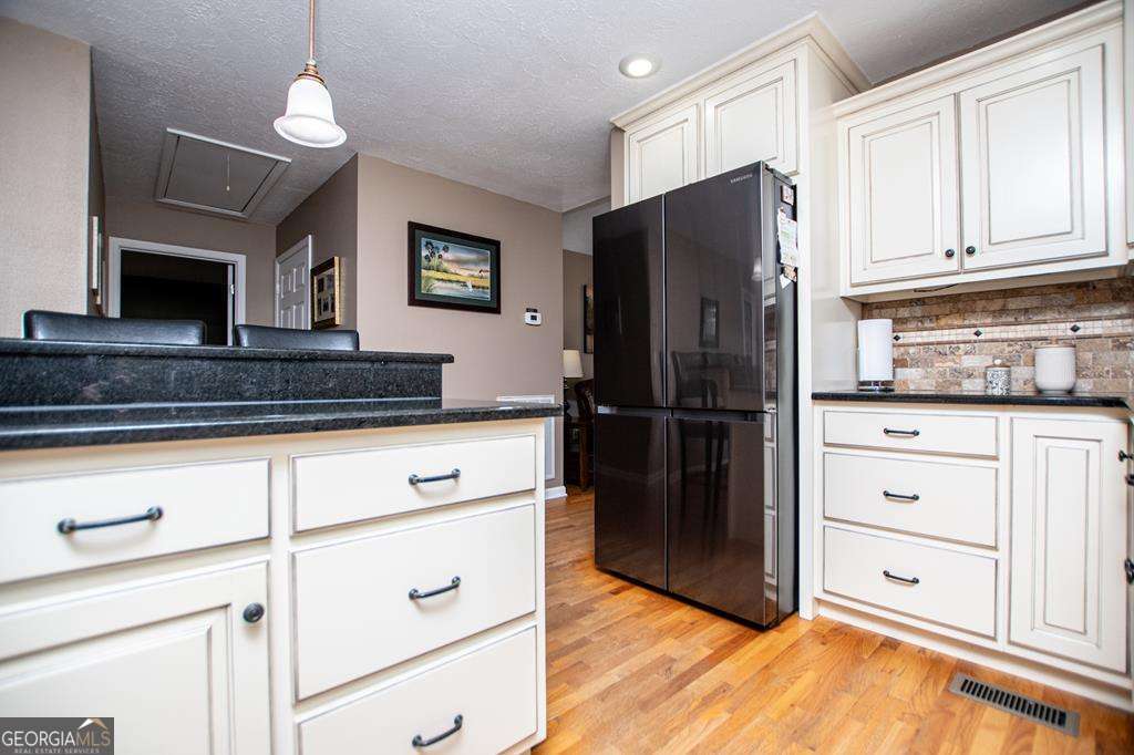 2 Pine Hill Drive Ranburne, AL 36273 - Photo 29 of 91 a kitchen with appliances a refrigerator and cabinets