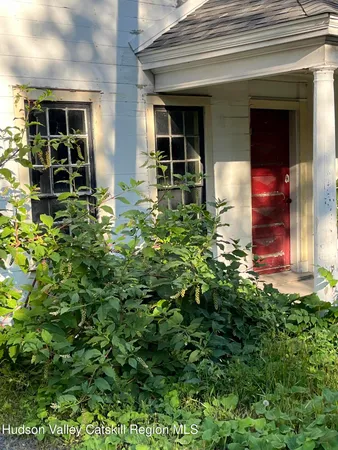 front view of the house with a yard