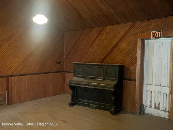 a view of outdoor space with wooden floor