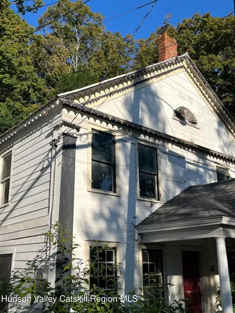 a view of a house with a street