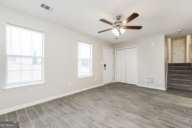 a view of a kitchen with a sink wooden floor