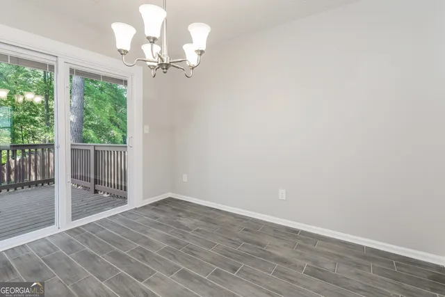 a kitchen with cabinets appliances a sink and a window