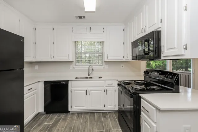 a kitchen with a stove and a sink