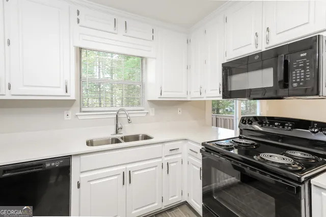 an empty room with closet and a chandelier fan