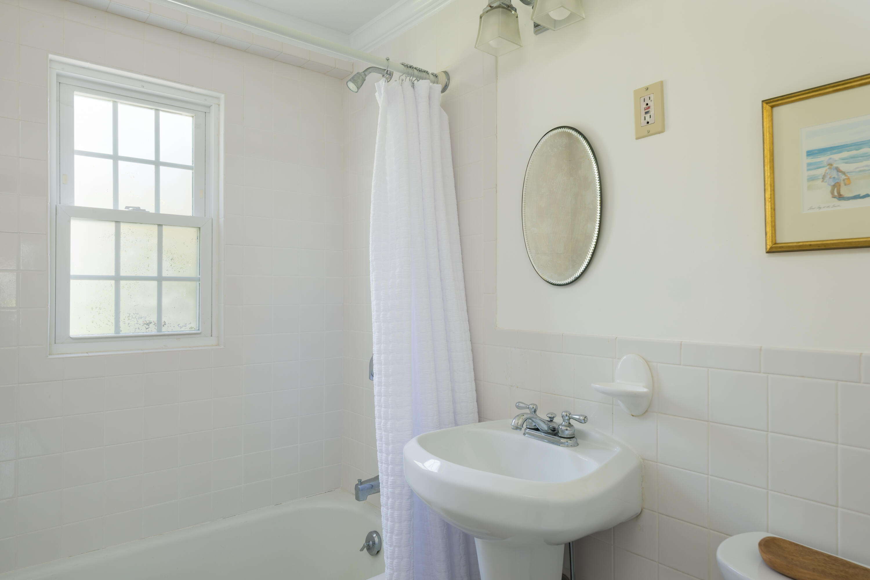 111 Lewis Road West Yarmouth, MA 02673 - Photo 18 of 43 a bathroom with a sink a mirror and a shower