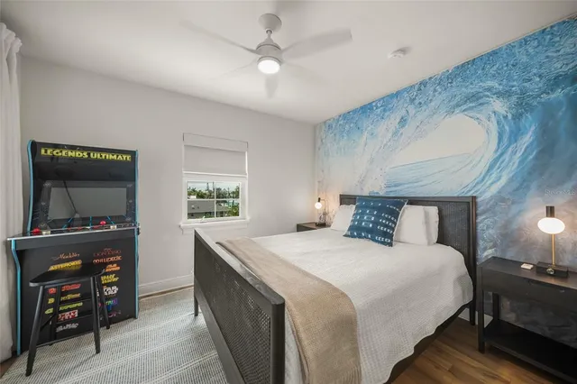 a bedroom with a bed and a flat screen tv