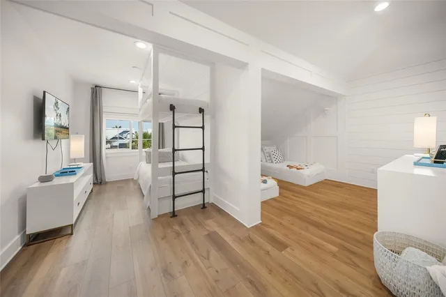 a spacious bedroom with a bed and a view of bathroom