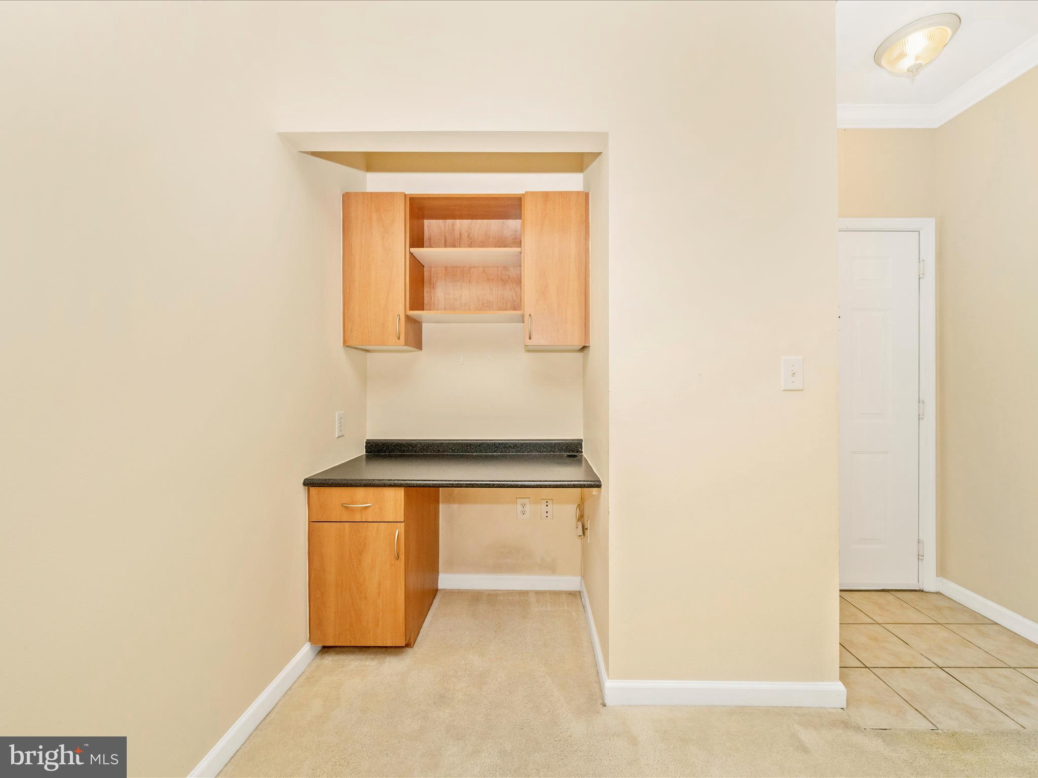 19606 Galway Bay Circle, Unit 401 Germantown, MD 20874 - Photo 16 of 50 a room with table and chair