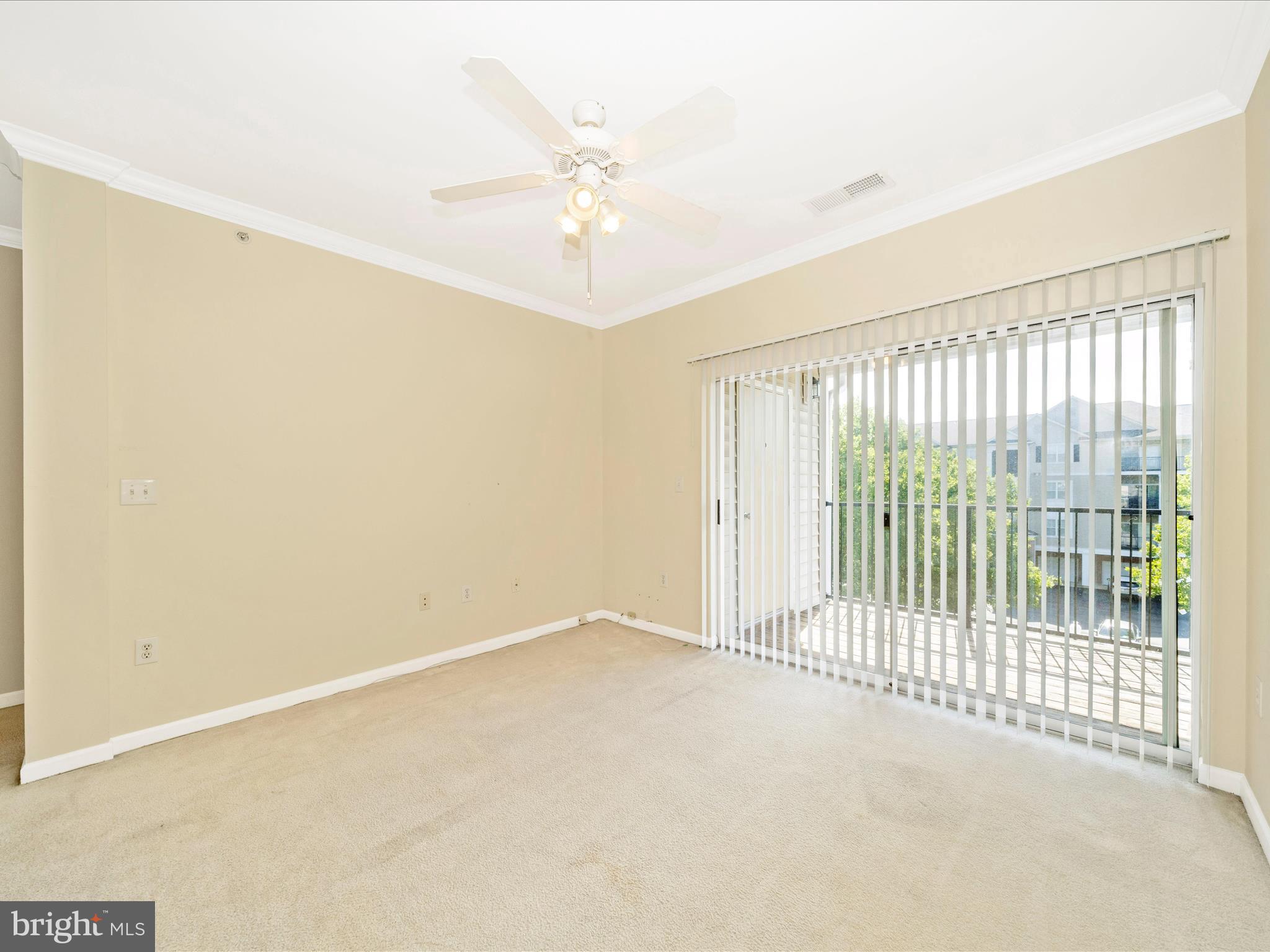 19606 Galway Bay Circle, Unit 401 Germantown, MD 20874 - Photo 19 of 50 an empty room with chandelier fan