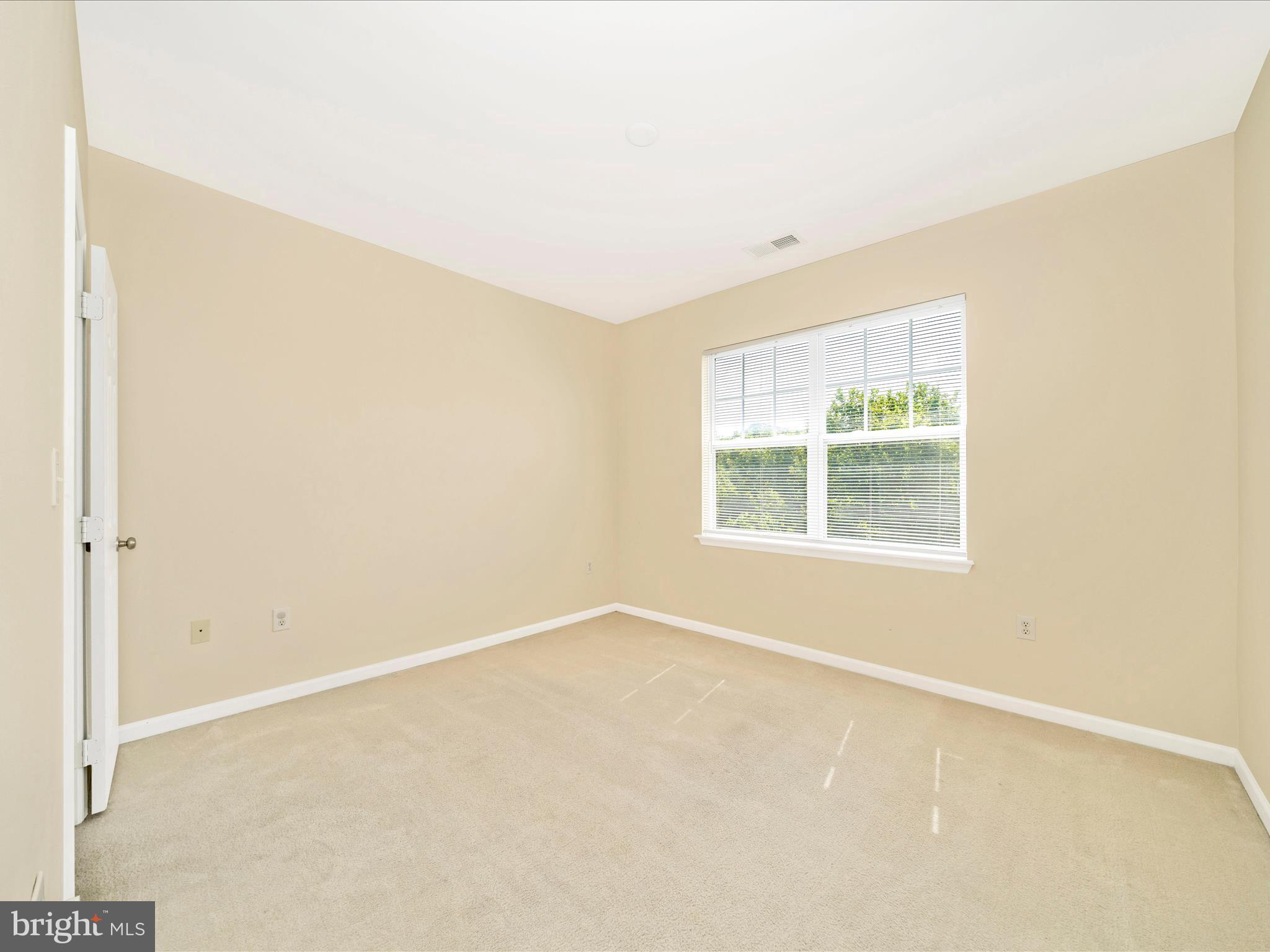 19606 Galway Bay Circle, Unit 401 Germantown, MD 20874 - Photo 30 of 50 an empty room with a window