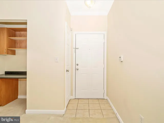 an empty room with an entrance door