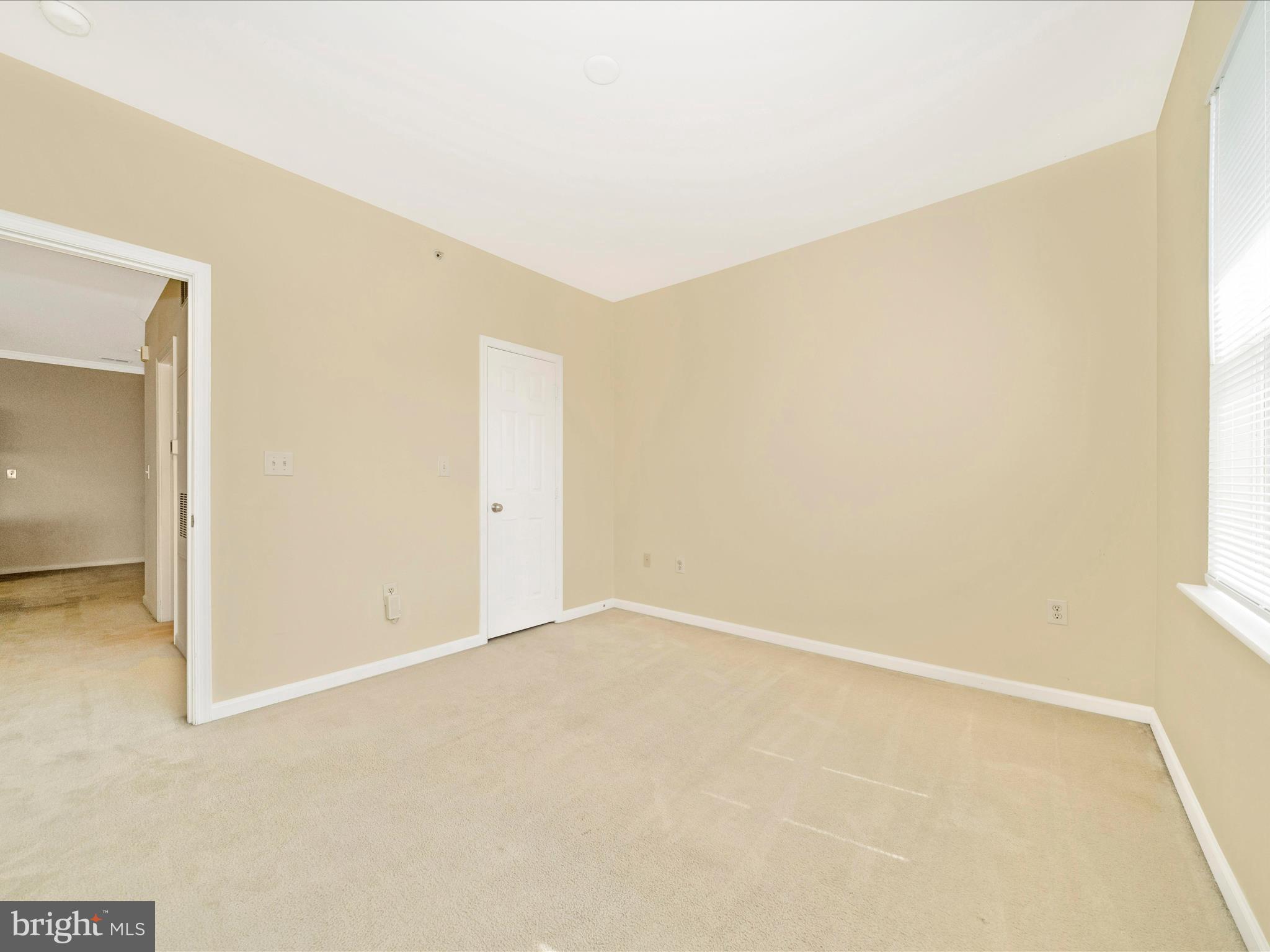 19606 Galway Bay Circle, Unit 401 Germantown, MD 20874 - Photo 31 of 50 an empty room with a natural light