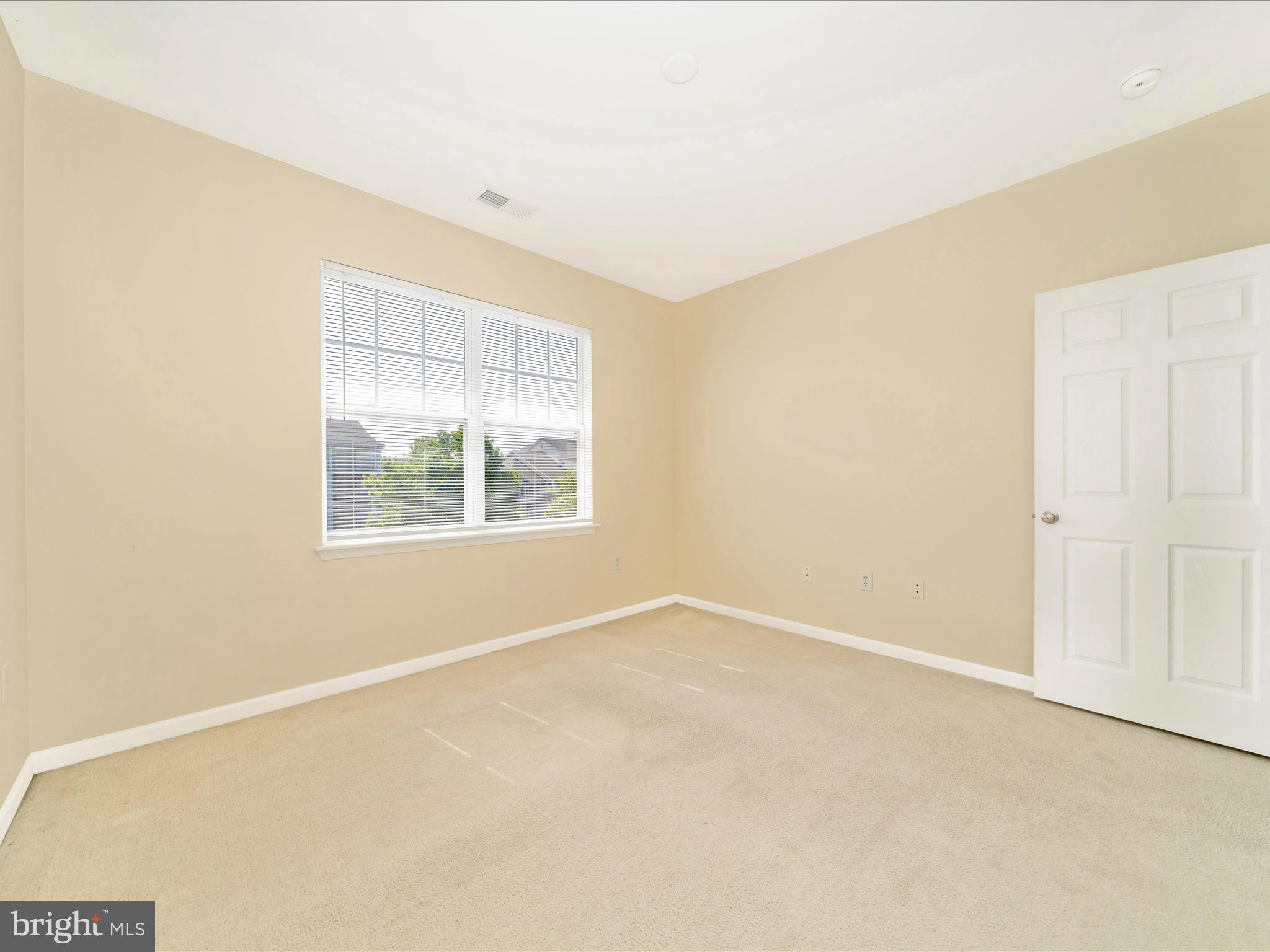 19606 Galway Bay Circle, Unit 401 Germantown, MD 20874 - Photo 33 of 50 an empty room with windows