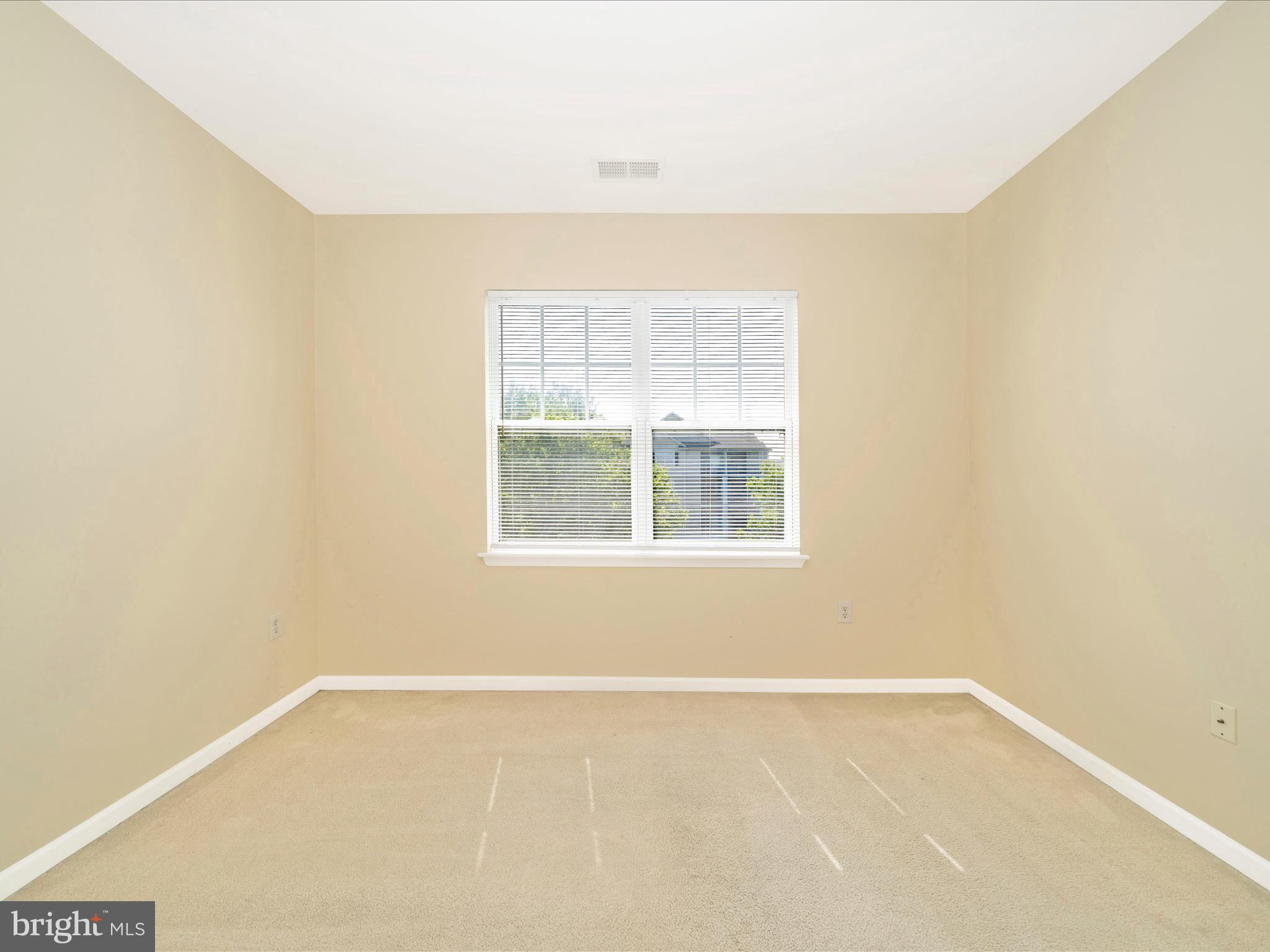19606 Galway Bay Circle, Unit 401 Germantown, MD 20874 - Photo 34 of 50 an empty room with a window