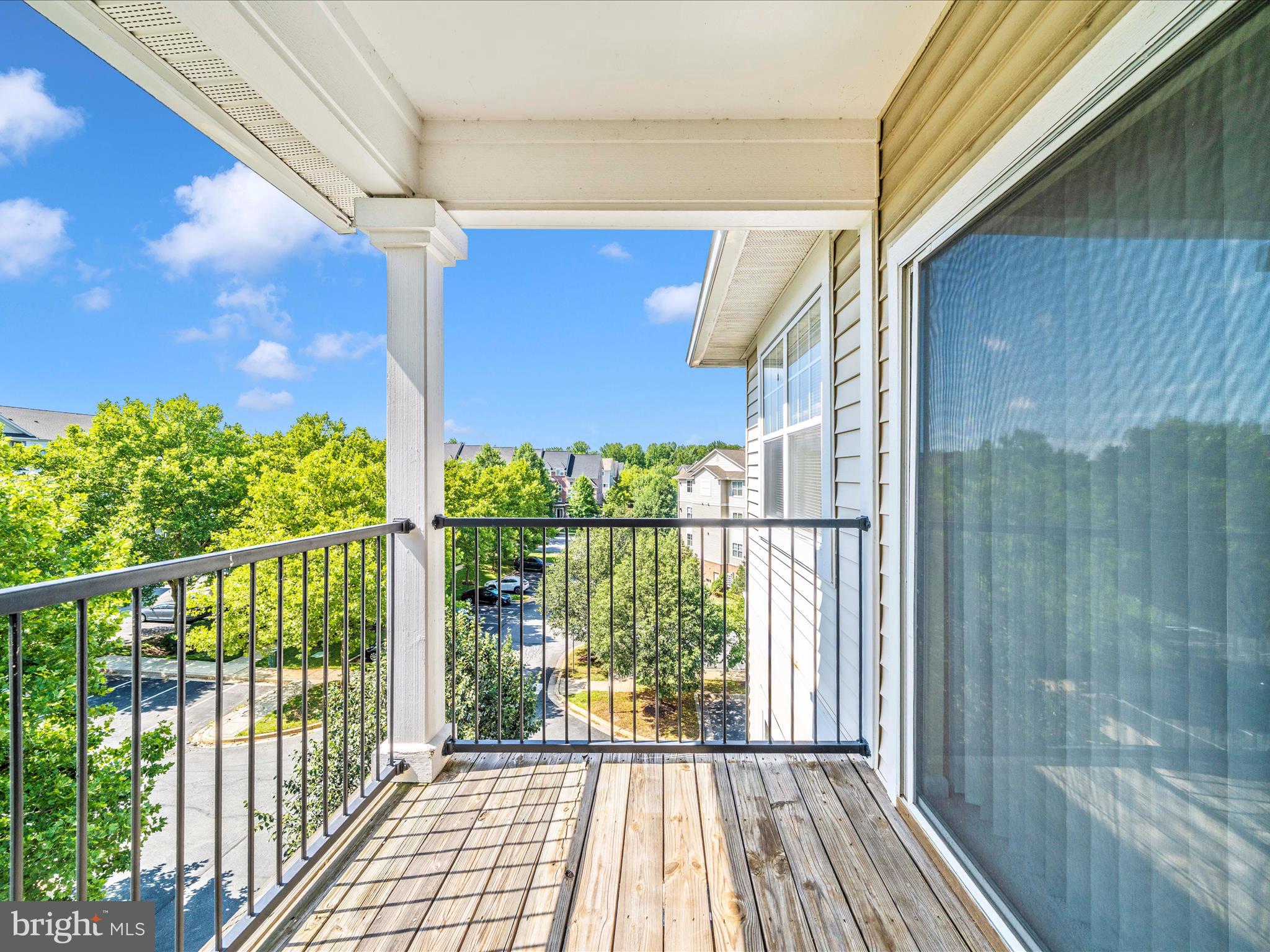 19606 Galway Bay Circle, Unit 401 Germantown, MD 20874 - Photo 41 of 50 a view of a balcony with wooden floor