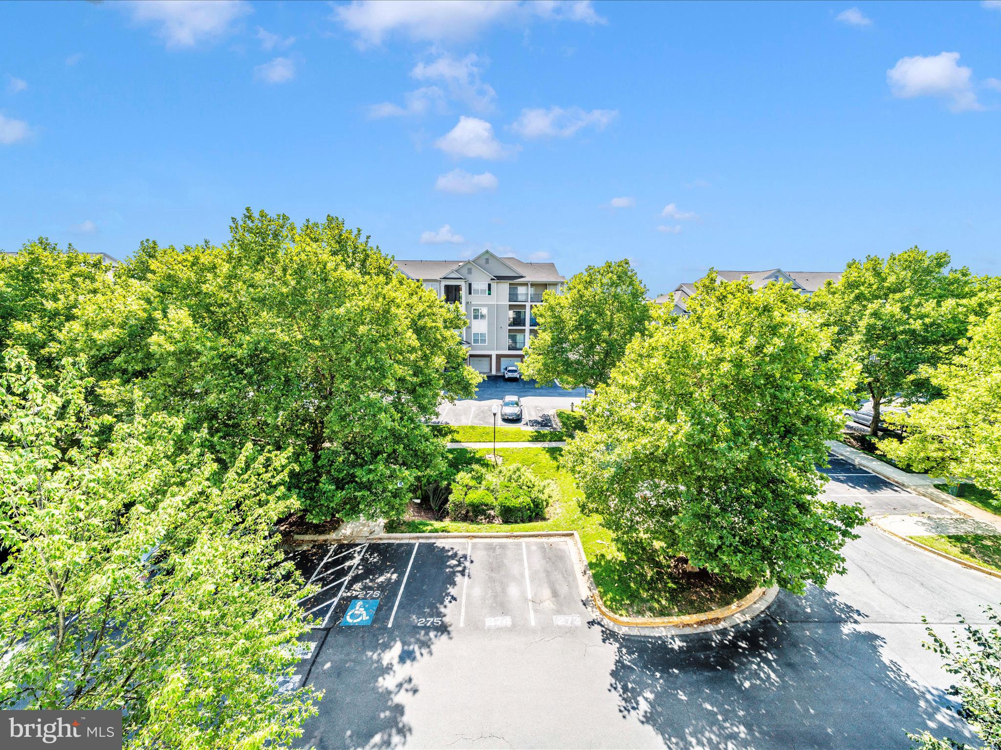 19606 Galway Bay Circle, Unit 401 Germantown, MD 20874 - Photo 42 of 50 a building view with a garden space