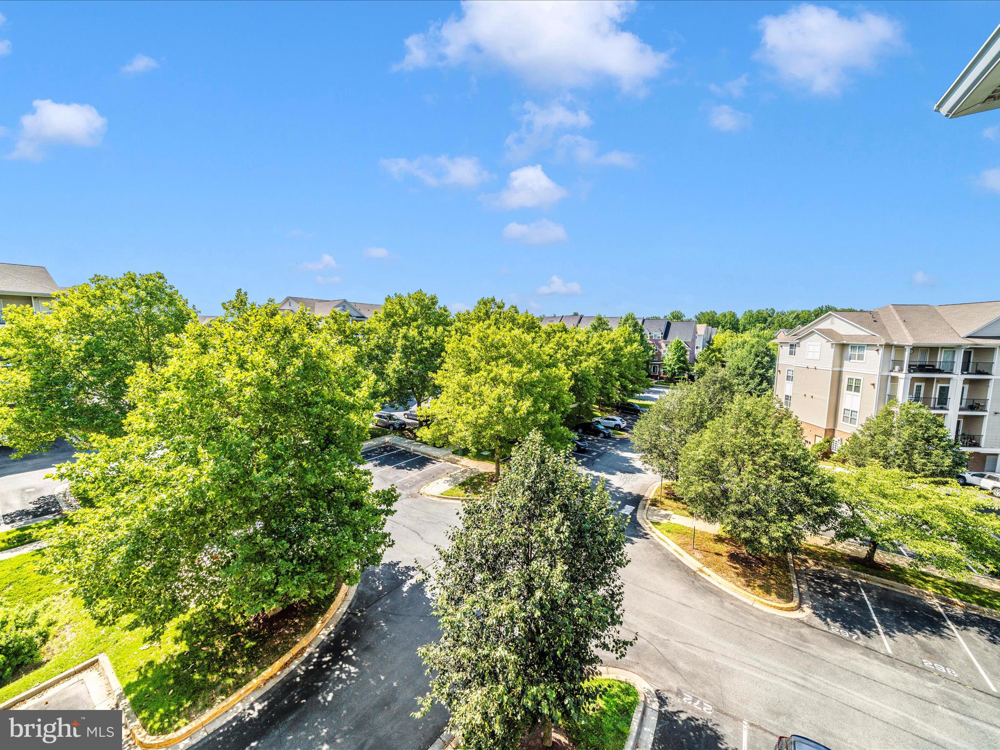 19606 Galway Bay Circle, Unit 401 Germantown, MD 20874 - Photo 43 of 50 a view of a lake with a building in background