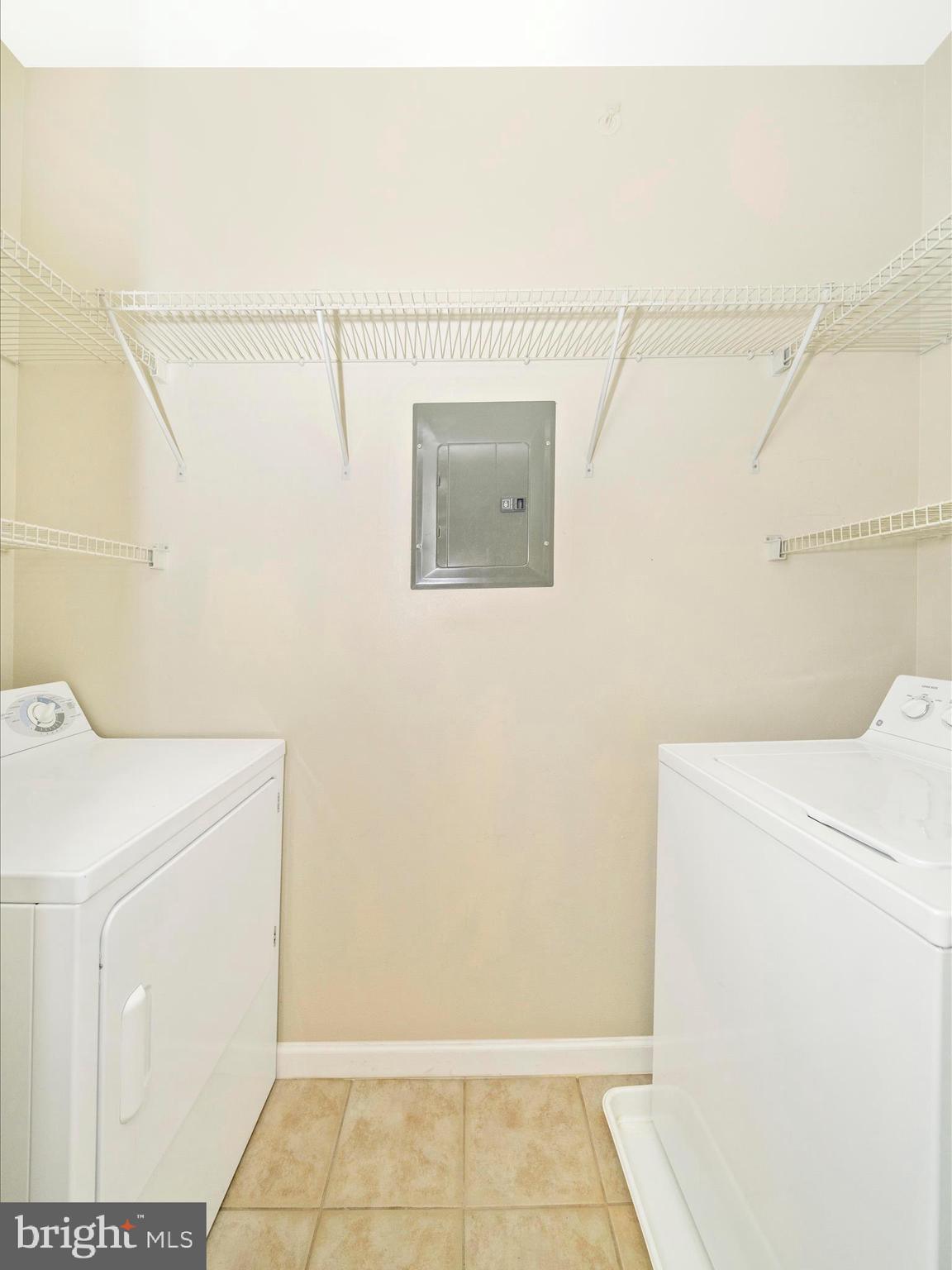 19606 Galway Bay Circle, Unit 401 Germantown, MD 20874 - Photo 44 of 50 a utility room with dryer and washer