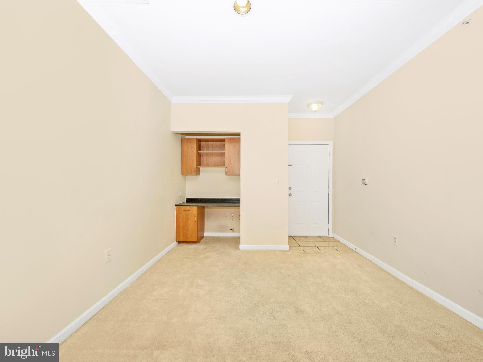 19606 Galway Bay Circle, Unit 401 Germantown, MD 20874 - Photo 6 of 50 an empty room with an entrance door