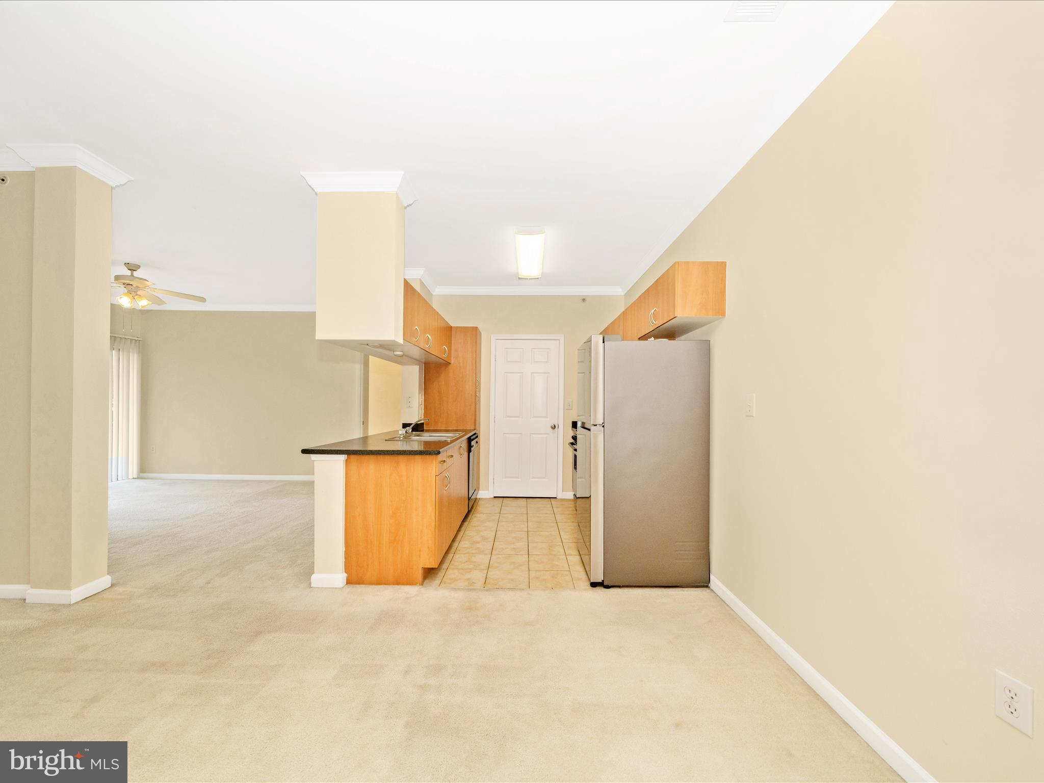 19606 Galway Bay Circle, Unit 401 Germantown, MD 20874 - Photo 10 of 50 a view of a kitchen with kitchen island a refrigerator a sink and a stove
